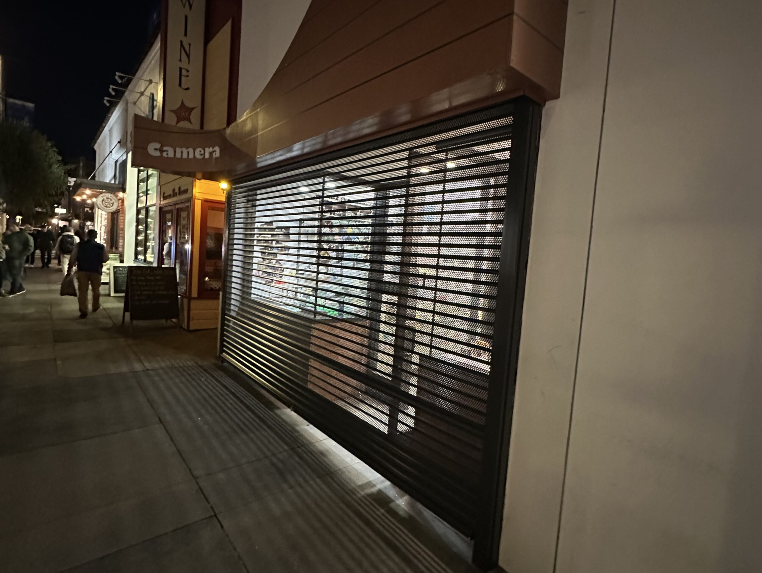 Perforated rolling security shutters installed on the exterior of a San Francisco, California business