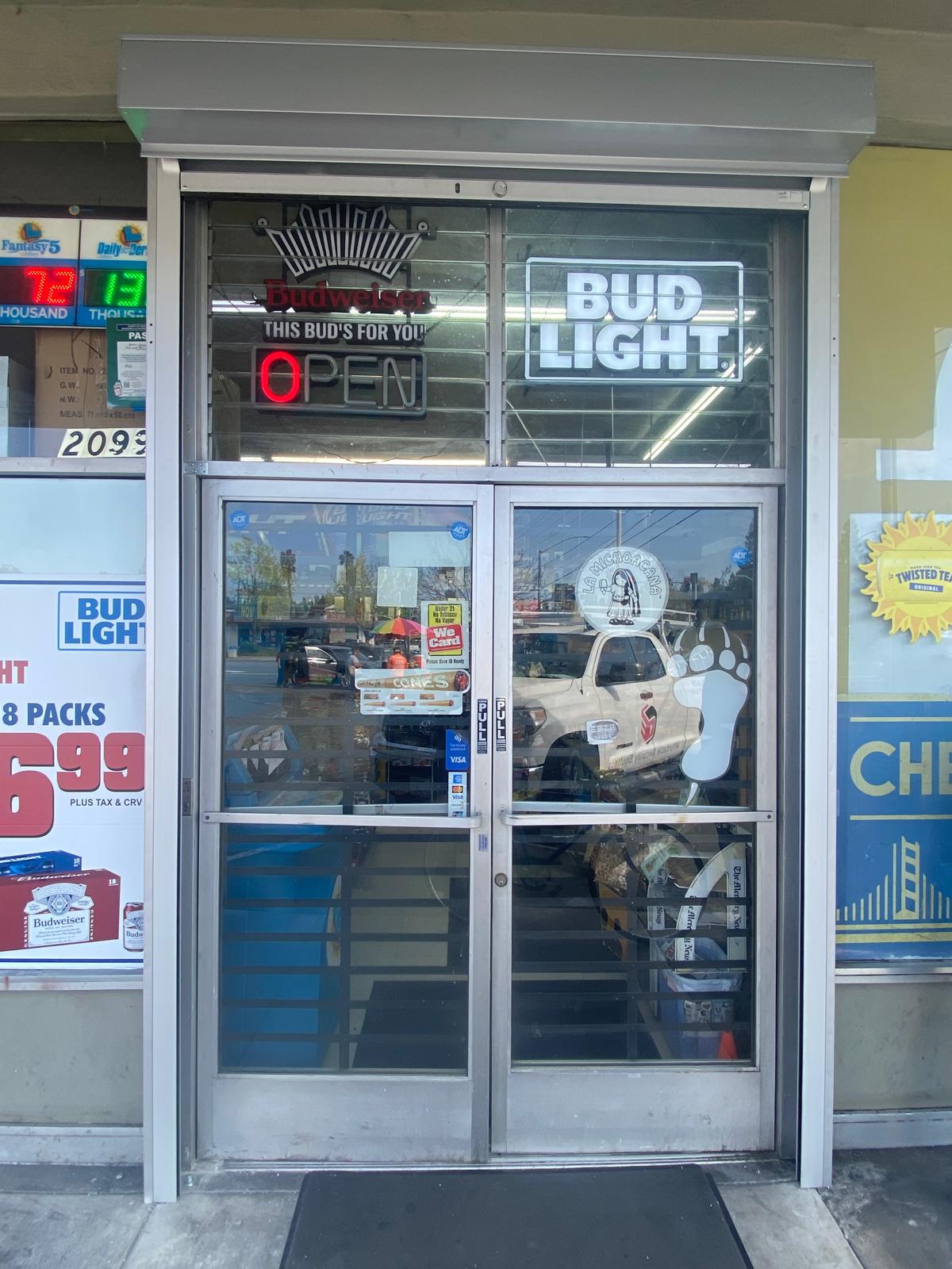 Exterior rolling security shutters installed at a San Jose, California business storefront