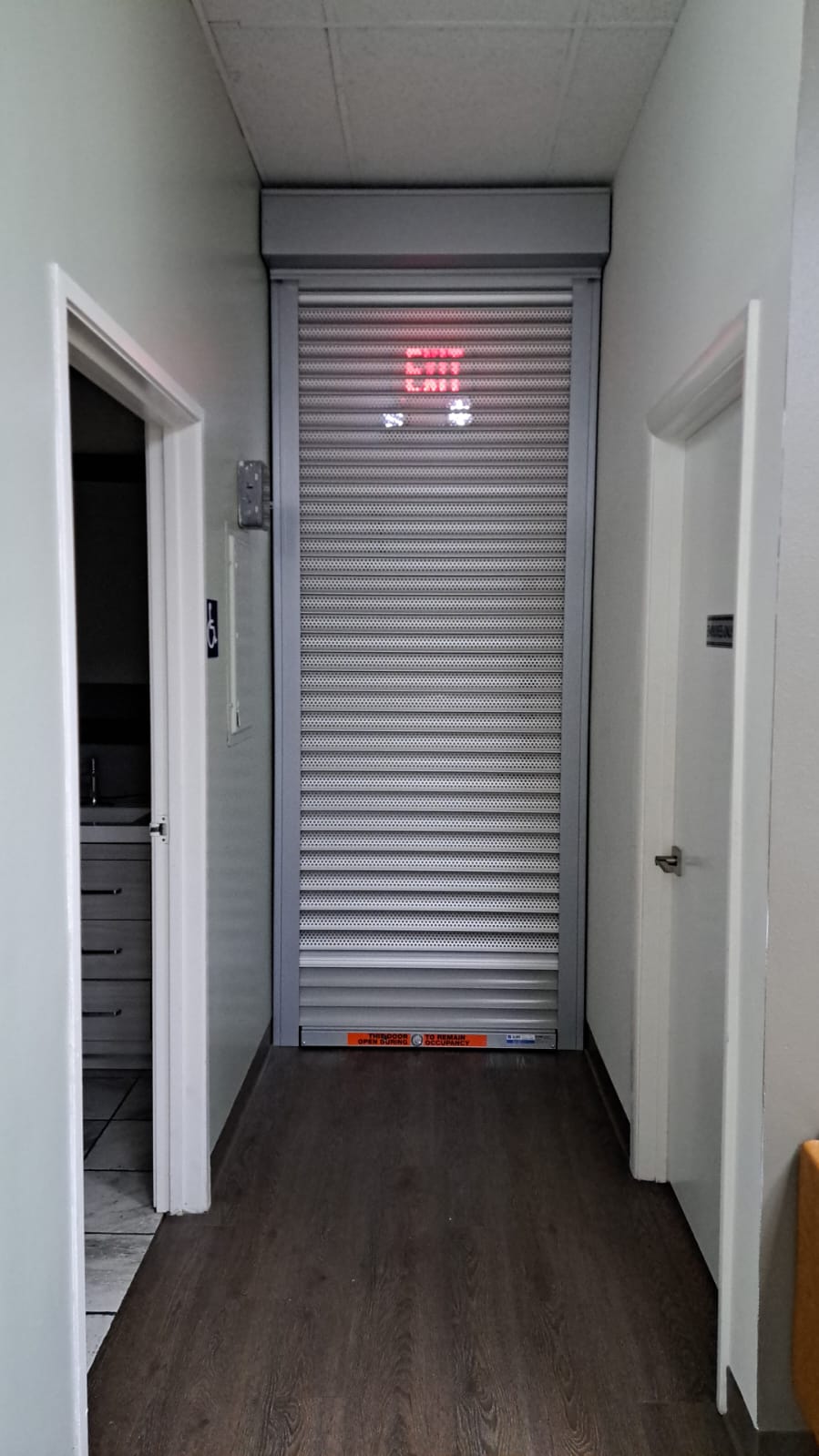 Semi-perforated rolling security shutters installed inside a Santa Clarita, California business